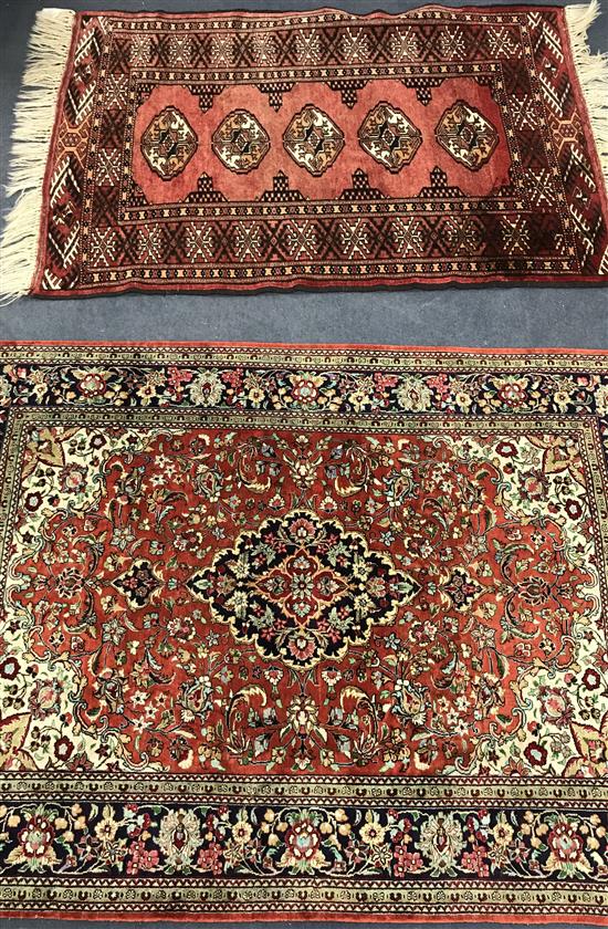 A Tabriz silk red ground medallion rug and another pink ground rug 144 x 102cm and 125 x 85cm